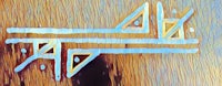 a painting of a triangle on a wooden surface